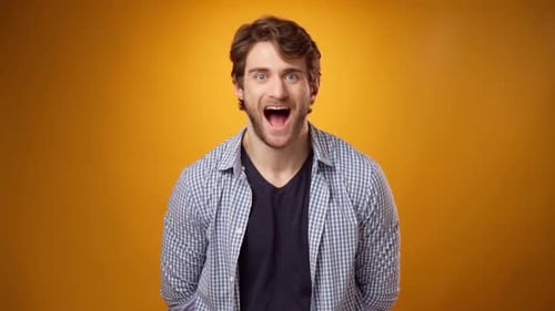 Man Reacts to Surprise with Open Mouth