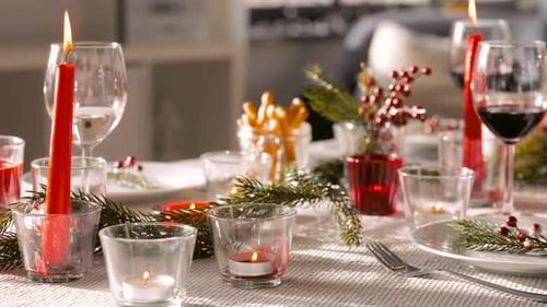 Festive Holiday Table Setting with Candles and Wine