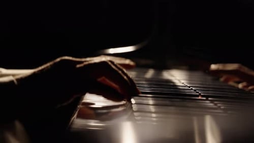 Hands Playing Piano in Dark, Moody Lighting