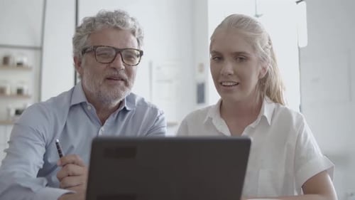 Front View of CEO in Glasses Talking with Female Secretary