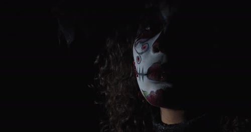 Portrait of a Woman with Her Face Painted As a Skull Glitter Santa Muerte