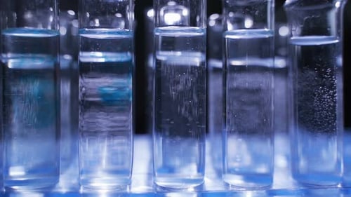 Blue Liquid Added to Laboratory Test Tubes