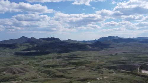 Aerial View of an Impressive Mountain Landscape Surrounded By Clouds