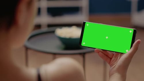 Close Up of Mobile Phone with Horizontal Green Screen on Display