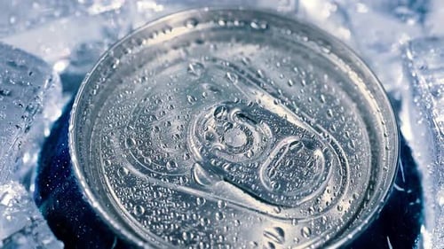 Aluminum Soda Tin Can Lid Cover of Soft Drink on Ice Goes Around the Circle
