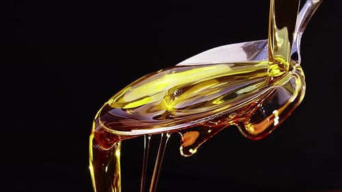 Olive Oil Pouring On A Spoon