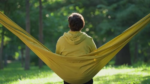 Woman relaxing in a hammock