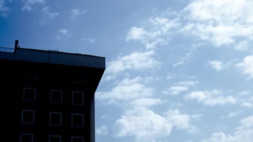 Modern Building against Blue Sky and Clouds