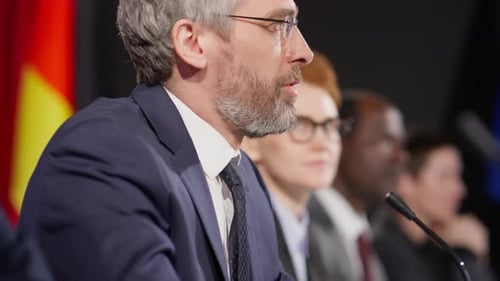 Professionals Participating in Corporate Meeting and Discussion