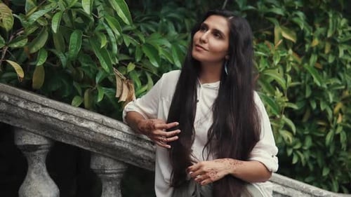 Woman Posing with Henna in a Green Garden