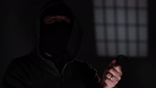 Burglar Robber invades a home with a gun knife and crowbar