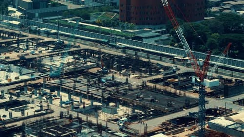Large Construction Site with Heavy Construction Machinery in Metropolis