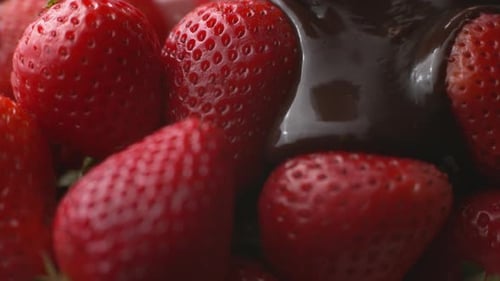 Pouring chocolate onto strawberries in super slow motion, shot on Phantom Flex 4K