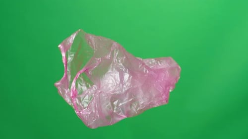 Red Plastic Bag On Green Screen Background