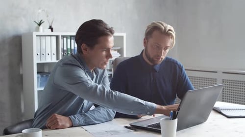 Two business persons are work together in modern office. Team of businessmen.