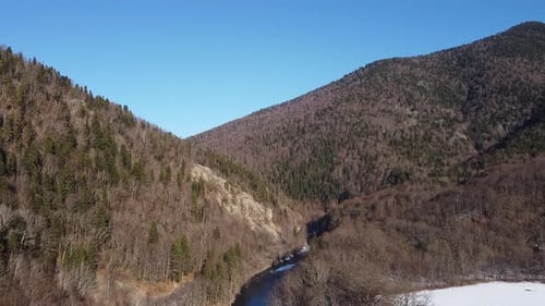 View of the beautiful snow-capped mountains on a winter day. Drone camera.