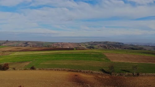 Aerial View of Rolling Farmlands and Fields