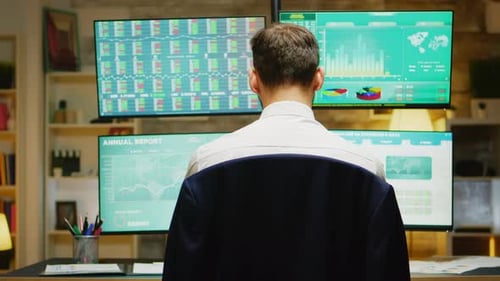 Portrait of Financial Broker Turning and Looking at the Camera