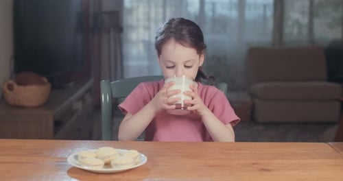Girl Drinking Milk with a Cookie Mustache
