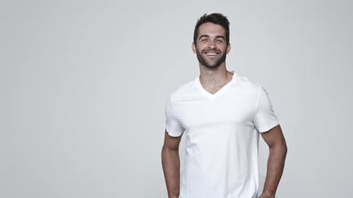 Man Smiling and Posing in White T-shirt