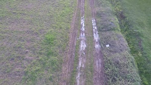 Aerial Muddy Road in Field