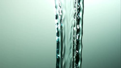 Water pouring and splashing in ultra slow motion 1500fps on a reflective surface - WATER POURS