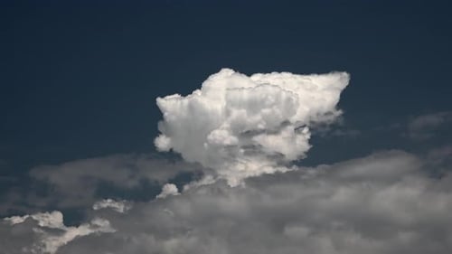 Dramatic Puffy White Cloud Against a Deep Blue Sky