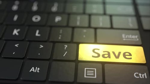 Black Computer Keyboard and Gold Save Key