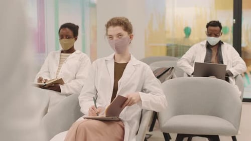 Doctors Attending a Lecture During Pandemic