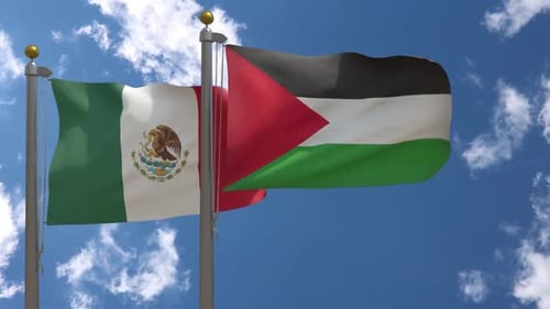Realistic Waving Flags of Mexico and Palestine Against Blue Sky