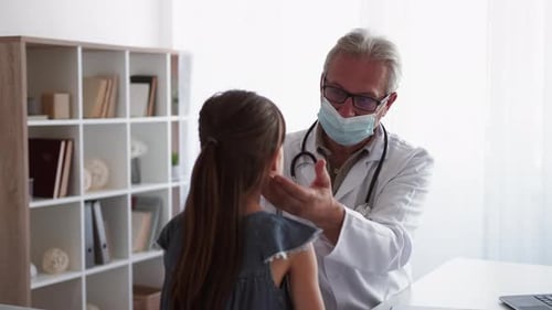 Doctor Examining a Child in Clinic