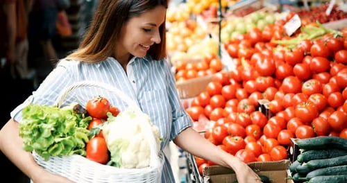 Woman Shopping for Fresh Vegetables at Market