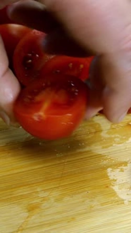 Tomato Slicing on Wooden Cutting Board Close Up