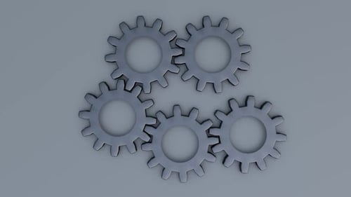 Smoothly Interlocking Metallic Gears Rotating on a Grey Background