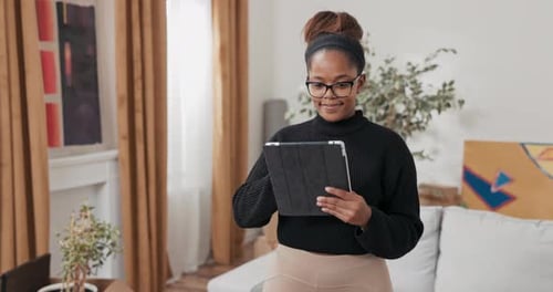 Smiling Girl Stands in the Middle of the Apartment About Renovation New House Moving Boxes Stand in