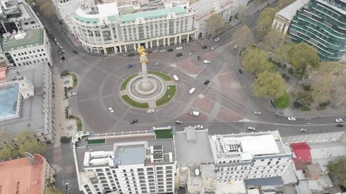 Flying over column of freedom in the center of Tbilisi. St. George monument