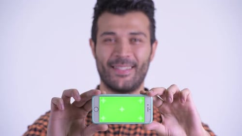 Man Holding Smartphone with Green Screen