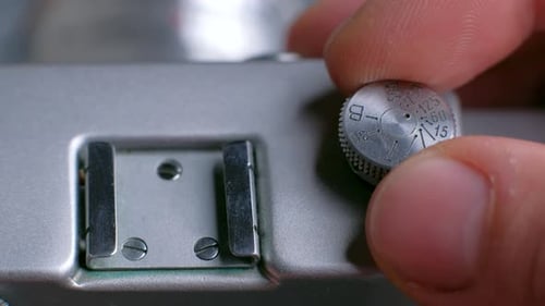 Adjusting Shutter Speed on a Vintage Film Camera