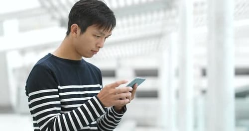 Man Use of Smart Phone in City