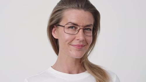 Woman with Glasses Smiling in Close-up