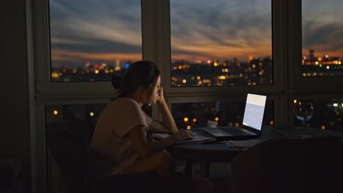 Woman Working at Computer Late at Night