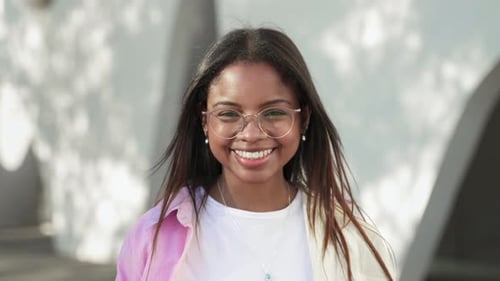 Smiling Young Woman with Glasses Portrait Close Up