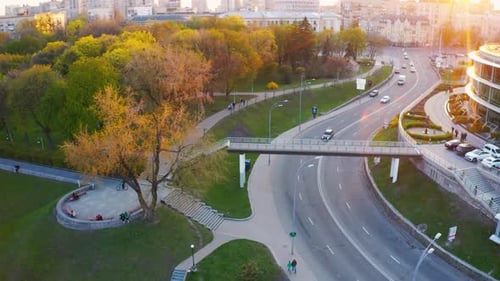 People Walk in the Park During a Beautiful Sunset. Aerial