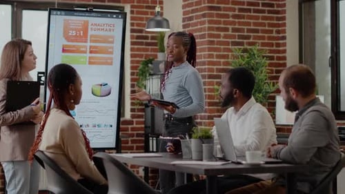 Business Team Analyzes Data in Meeting