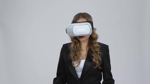 Woman Interacting with Virtual Reality Headset Technology
