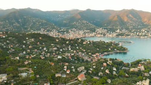 Aerial Footage of a Harbor with Vessels Santa Margherita Ligure with Mountains on the Background