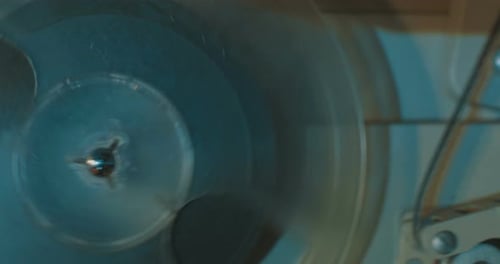 Film Reel Spinning Within an Old Projector