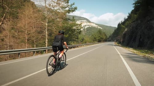 Cycling and triathlon concept. Professional road cyclist training on bicycle.