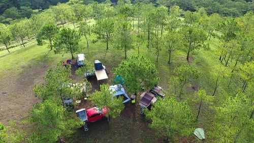 Aerial view of group Asian friends camp enjoying, relaxing nature on the hills