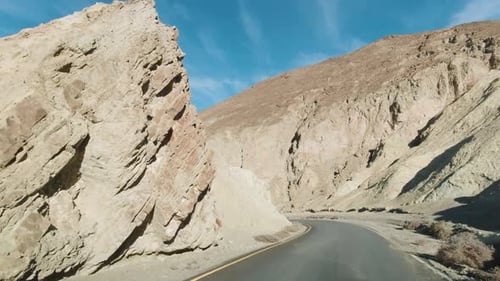 Car Driving on Road in Death Valley National Park. Artist Drive. California, USA